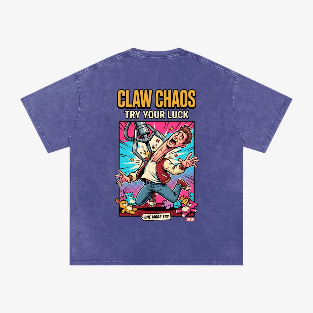 A purple mineral-wash t-shirt shown from the back, featuring a large colorful graphic print with the text 'CLAW CHAOS TRY YOUR LUCK' and a cartoon character.
