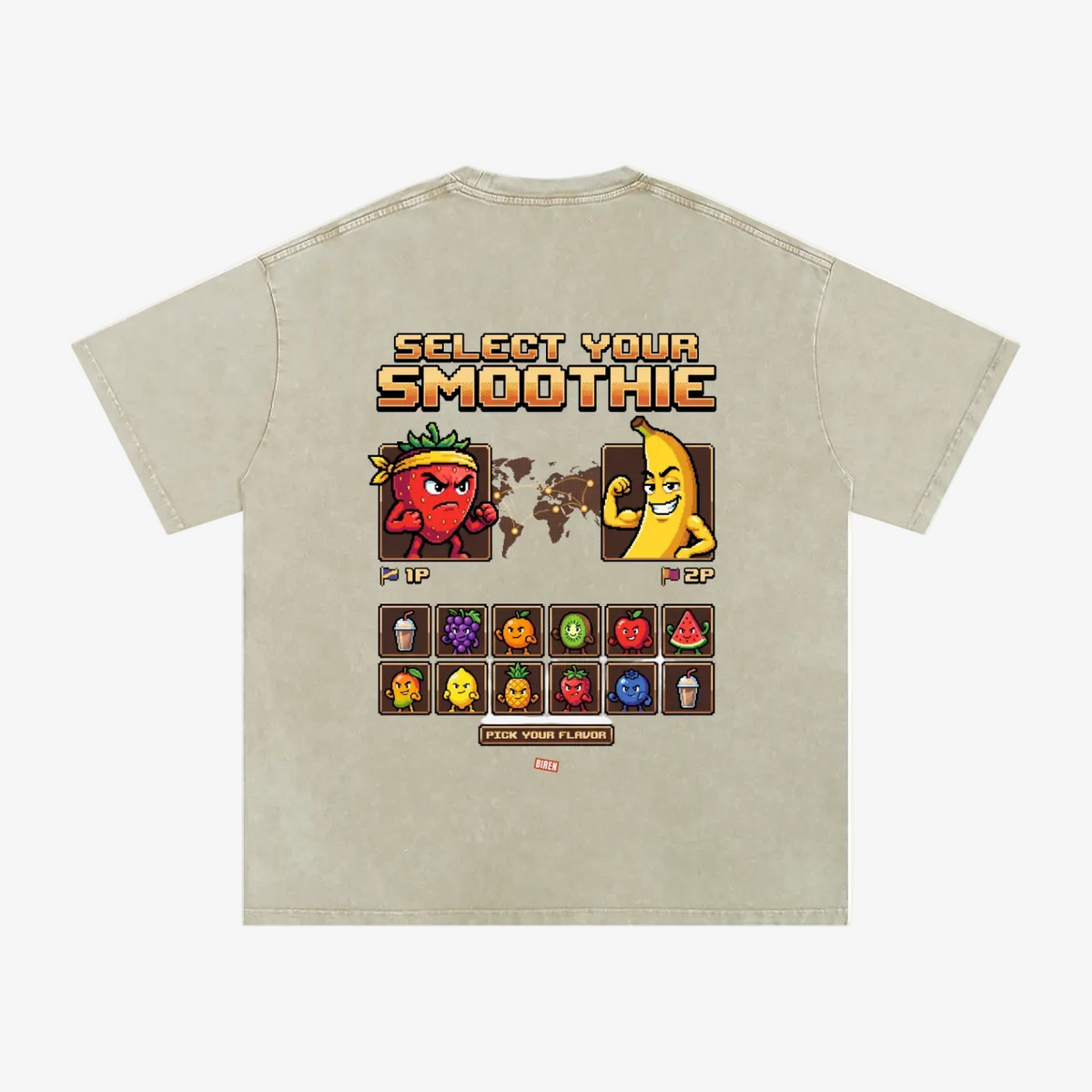 A light beige graphic t-shirt shown from the back, featuring a retro video game style 'Select Your Smoothie' design with pixel art characters and a grid of colorful smoothie icons.