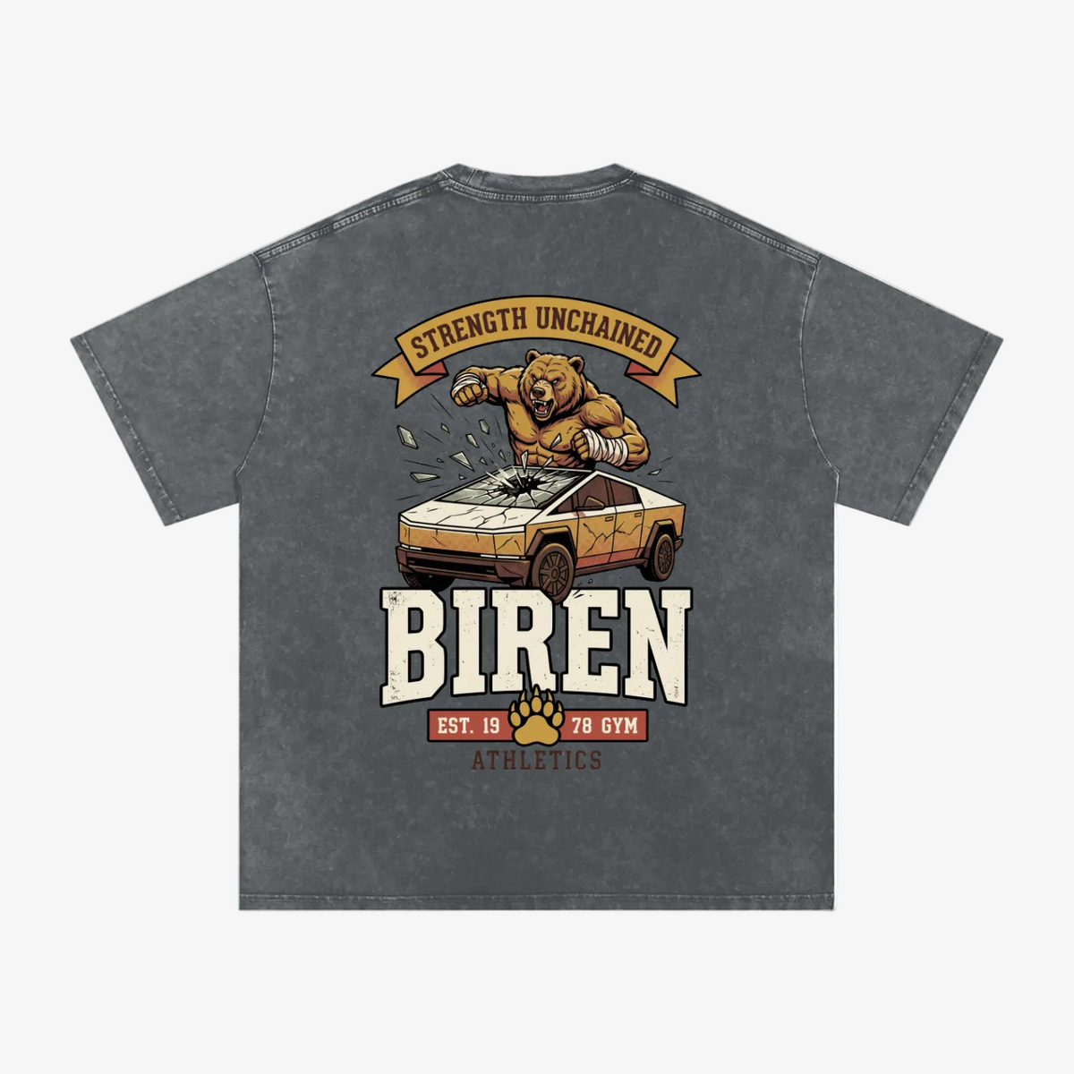 A dark gray acid-wash t-shirt with a vintage-style graphic on the back. The graphic features a muscular bear crushing a sports car, with banners reading 'STRENGTH UNCHAINED' and 'BIREN EST.