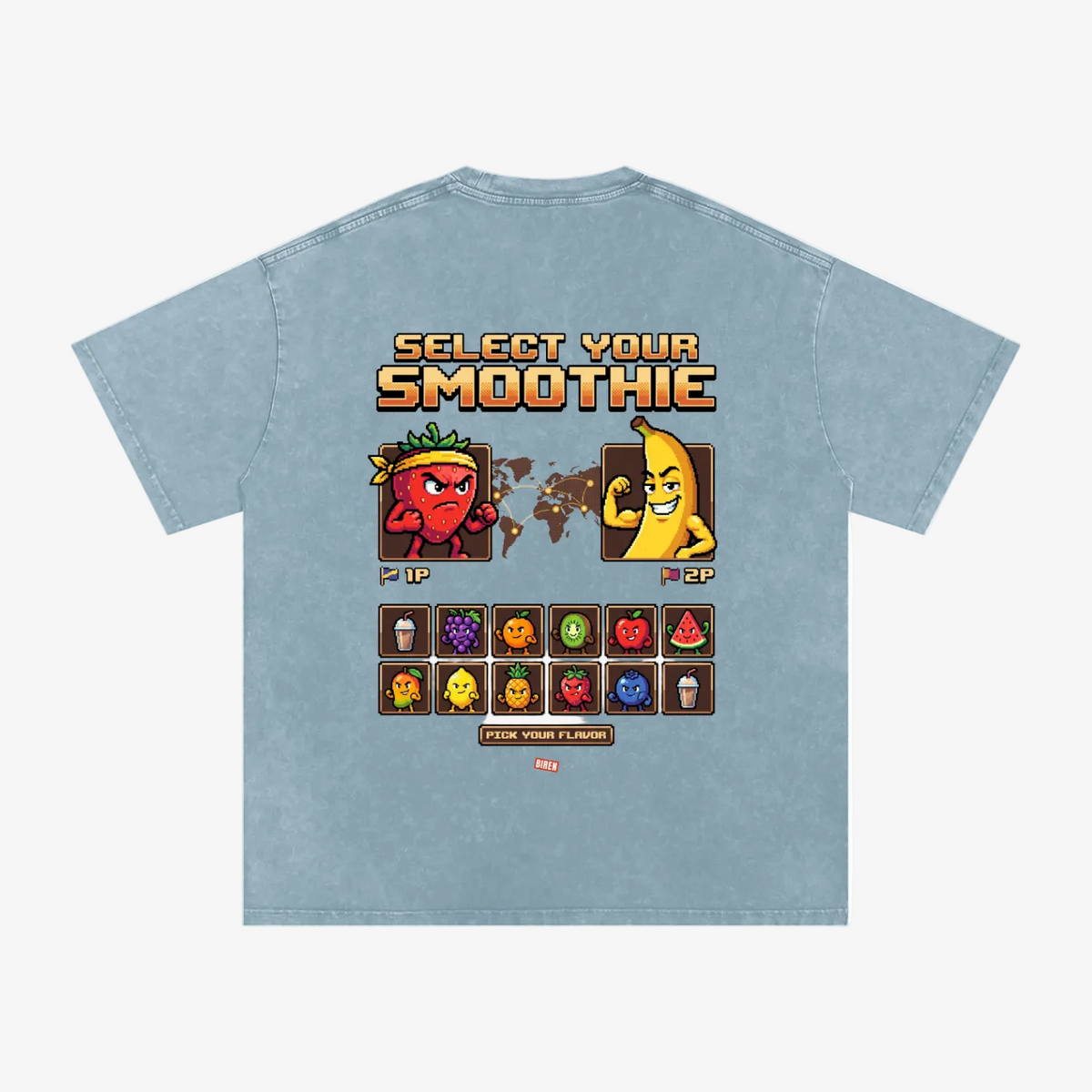 A light blue acid-wash t-shirt shown from the back, featuring a retro video game style graphic with the text 'SELECT YOUR SMOOTHIE' and pixel-art characters representing flavors.