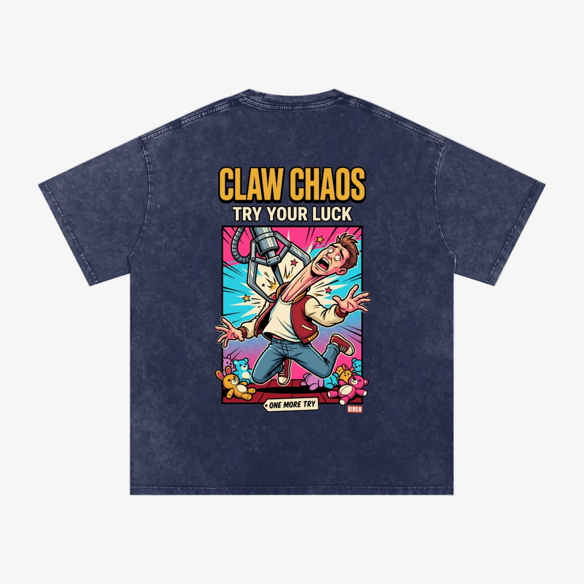 A dark navy blue acid-wash t-shirt shown from the back, featuring a colorful comic-style graphic of a man running from a claw machine with the text 'CLAW CHAOS TRY YOUR LUCK'.