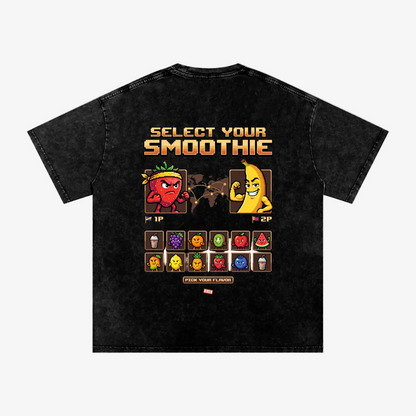 A black acid-wash graphic t-shirt shown from the back, featuring a retro video game-style smoothie selection screen with cartoon characters and flavor icons.