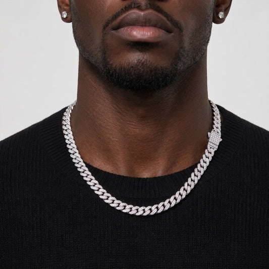 Man wearing an 8mm silver iced out Cuban link chain over a black t-shirt