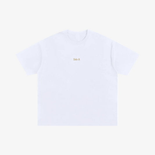 A white short-sleeve crewneck t-shirt with the words 'Take it' printed in a small gold font on the center chest, displayed flat against a solid white background.