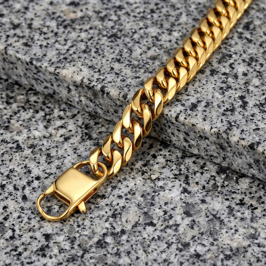 13mm gold Cuban link bracelet on granite