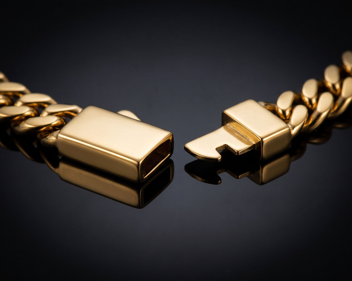 Open gold box clasp of the 8mm curb chain bracelet, box and tongue side by side