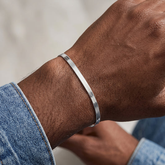 3mm silver herringbone bracelet worn with jeans
