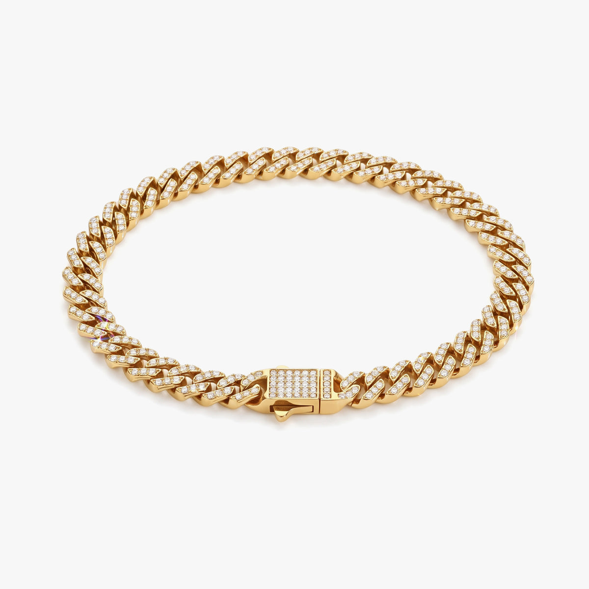 A gold Cuban link chain bracelet adorned with small clear pavé stones, featuring a rectangular clasp with a matching row of clear stones, set against a clean white background.