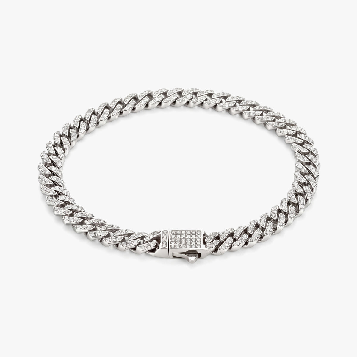 A silver-toned Cuban link chain bracelet with a rectangular clasp paved with small clear stones, photographed on a clean light gray background.