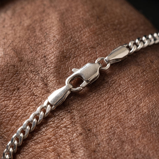 Close-up of the clasp on a 3mm silver Miami Cuban bracelet
