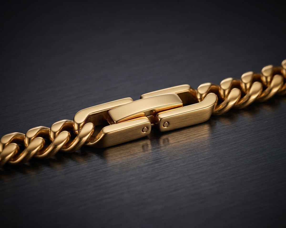 Macro of the gold fold-over clasp sitting flush in the 5mm Miami Cuban chain