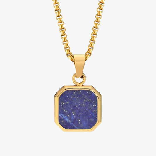 Gold necklace with a blue stone pendant on a white background
