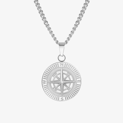 Silver compass pendant necklace on a white background