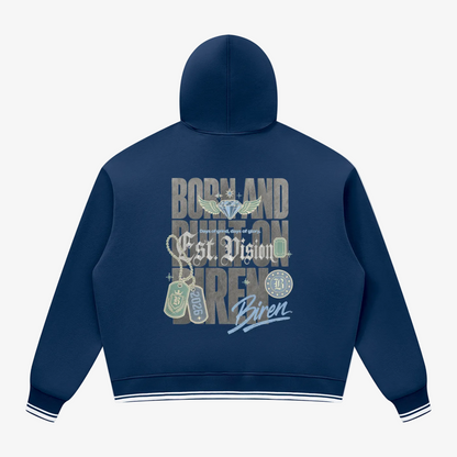 A navy blue hoodie shown from the back, featuring a large graphic print with the words 'BODY AND MIND ON BUREN', military-style insignia, dog tags, and a script signature reading 'Biren'. The hoodie has white and navy striped ribbed cuffs and hem, and is displayed on a clean white background.