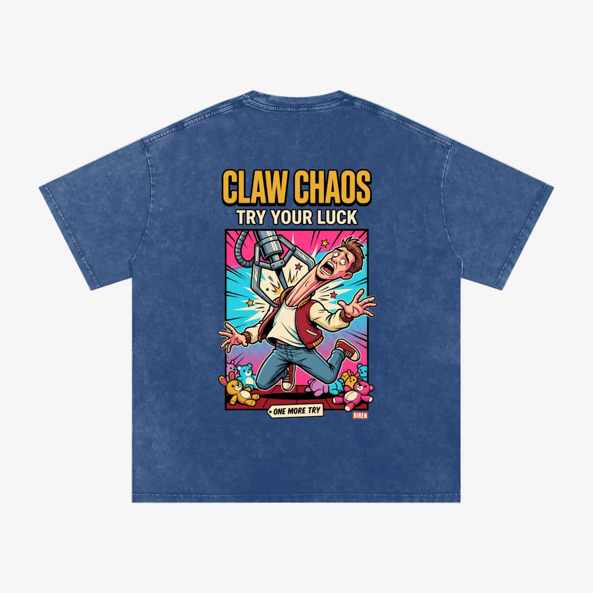A blue acid-wash t-shirt shown from the back, featuring a large graphic print with the text 'CLAW CHAOS TRY YOUR LUCK' and a cartoon character in a dynamic action pose surrounded by colorful effects.
