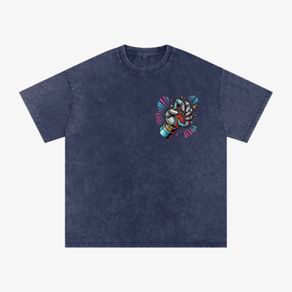 A black acid-wash short-sleeve t-shirt with a small graphic print on the left chest showing a woman with sunglasses and the text 'BLACK LADY BOTTLE'.