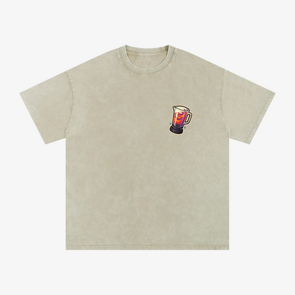 A light beige acid-wash t-shirt with a small graphic of a beer mug on the left chest, displayed flat against a solid white background.