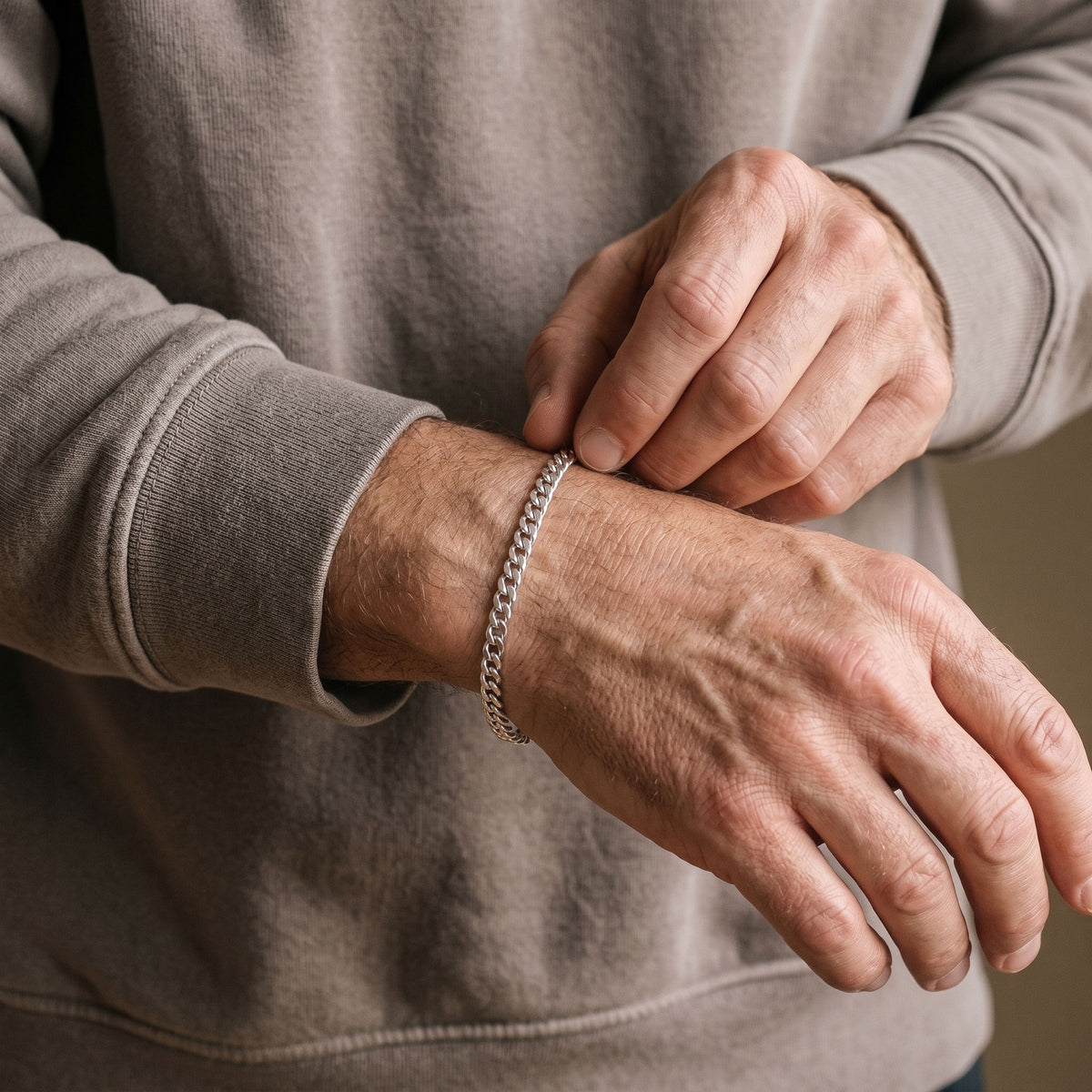 5mm silver curb chain bracelet on a man's wrist