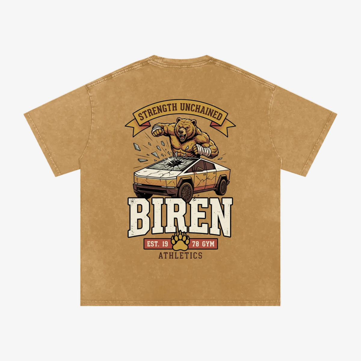 A tan short-sleeve t-shirt with a large graphic print on the back. The graphic features a cartoon bear crushing a car with the text 'STRENGTH UNCHAINED' above and 'BIREN' below, along with 'EST.