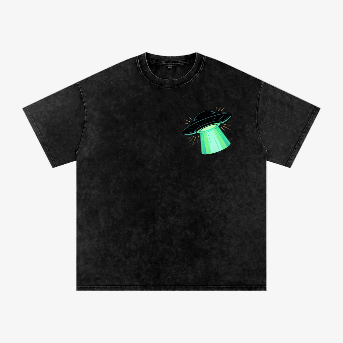 A black acid-wash short-sleeve t-shirt with a small chest graphic of a black flying saucer emitting a bright green beam, displayed on a solid white background.