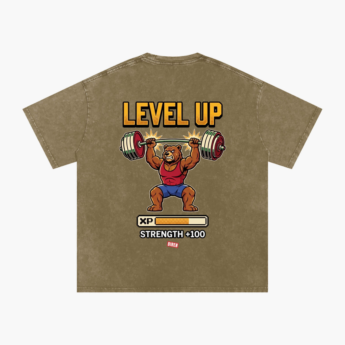A brown mineral-washed t-shirt featuring a retro-style graphic of a bear lifting a barbell with the text 'LEVEL UP' and 'STRENGTH +100 XP'.
