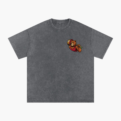 A dark gray mineral-wash short-sleeve t-shirt with a small cartoon graphic of a bear lifting a barbell on the left chest, displayed on a clean white background.