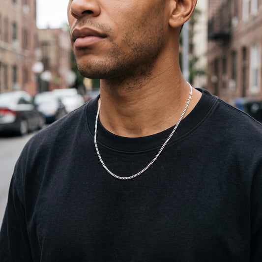 Man wearing a 3mm silver Miami Cuban chain over a black t-shirt