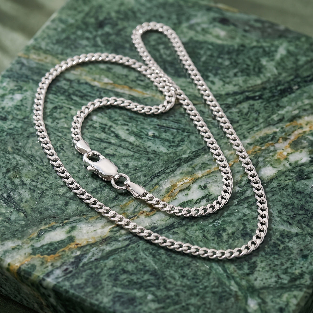 3mm silver Miami Cuban chain on green marble