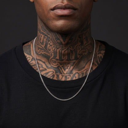 Man with tattoos wearing a 3mm silver Miami Cuban chain