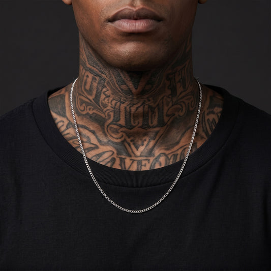 Man with tattoos wearing a 3mm silver Miami Cuban chain
