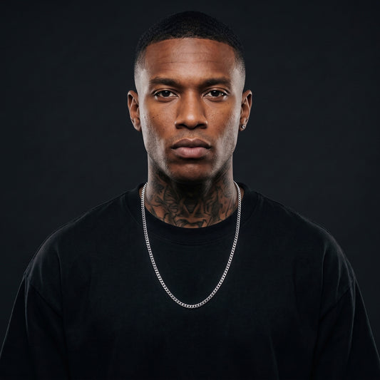 Man with tattoos wearing a 5mm silver Miami Cuban chain